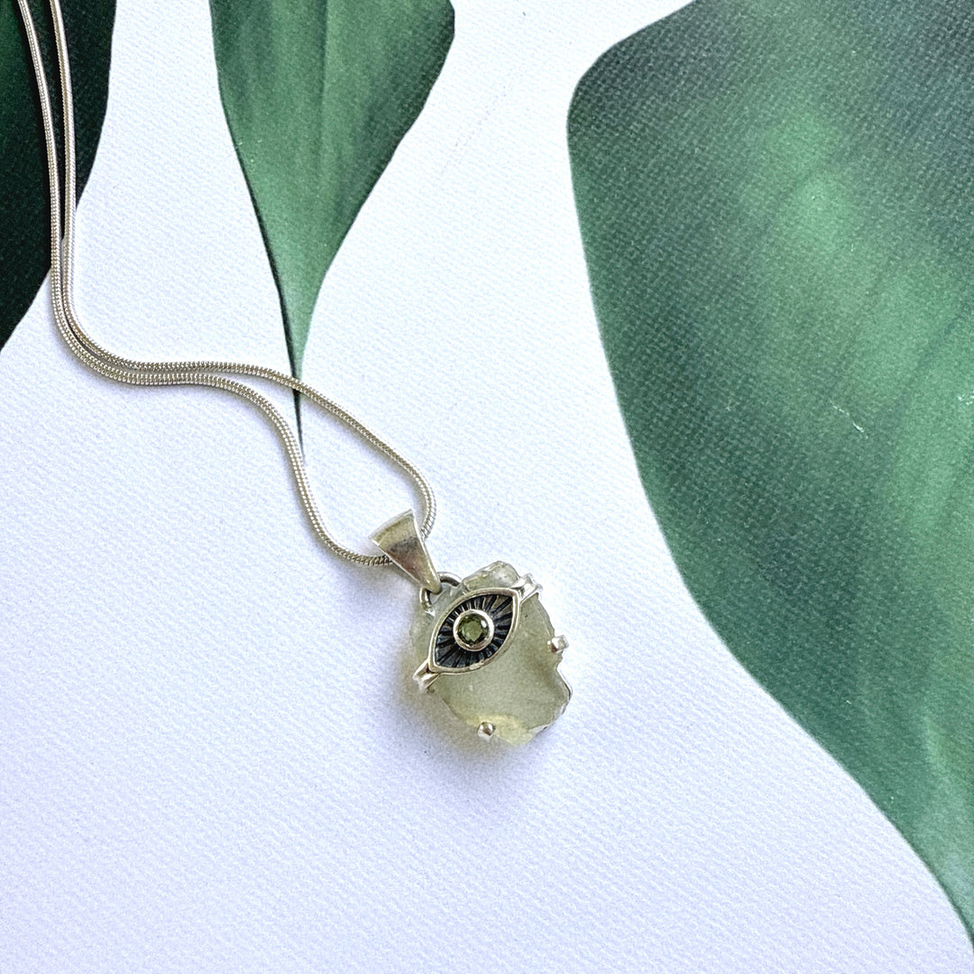 Faceted Moldavite and Libyan Desert Evil Eye Pendant