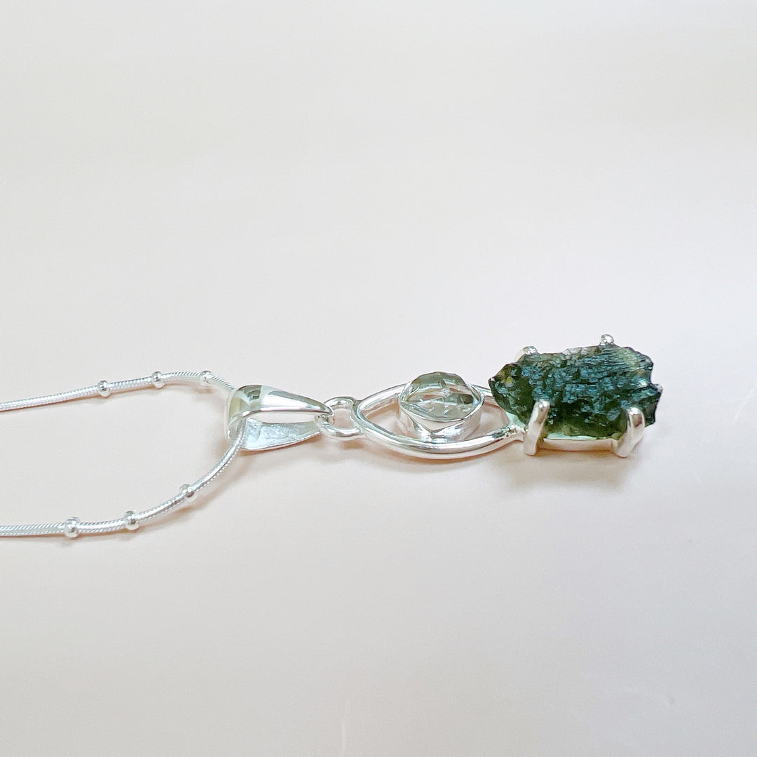 MOLDAVITE & HERKEMIER DIAMOND PENDANT