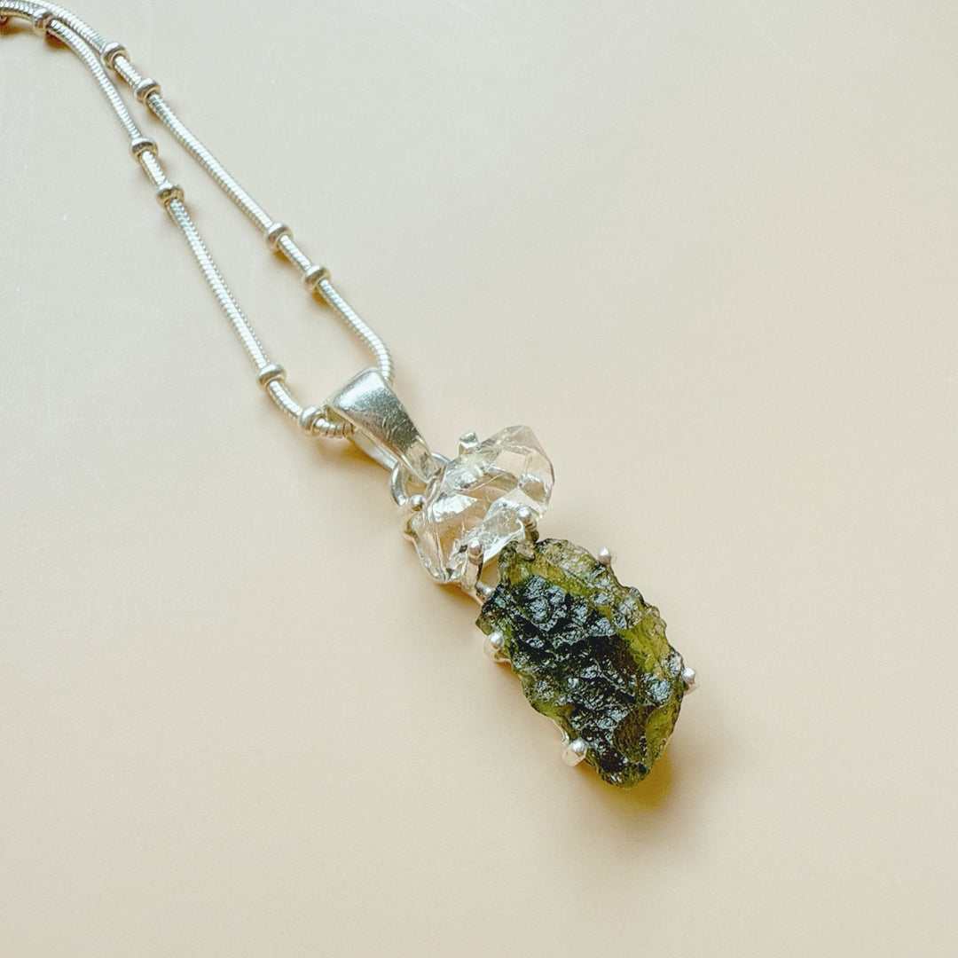 MOLDAVITE & HERKEMIER DIAMOND PENDANT