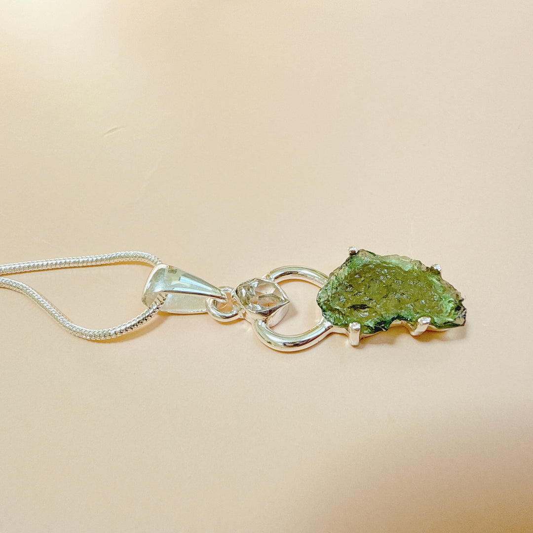 MOLDAVITE & HERKEMIER DIAMOND PENDANT