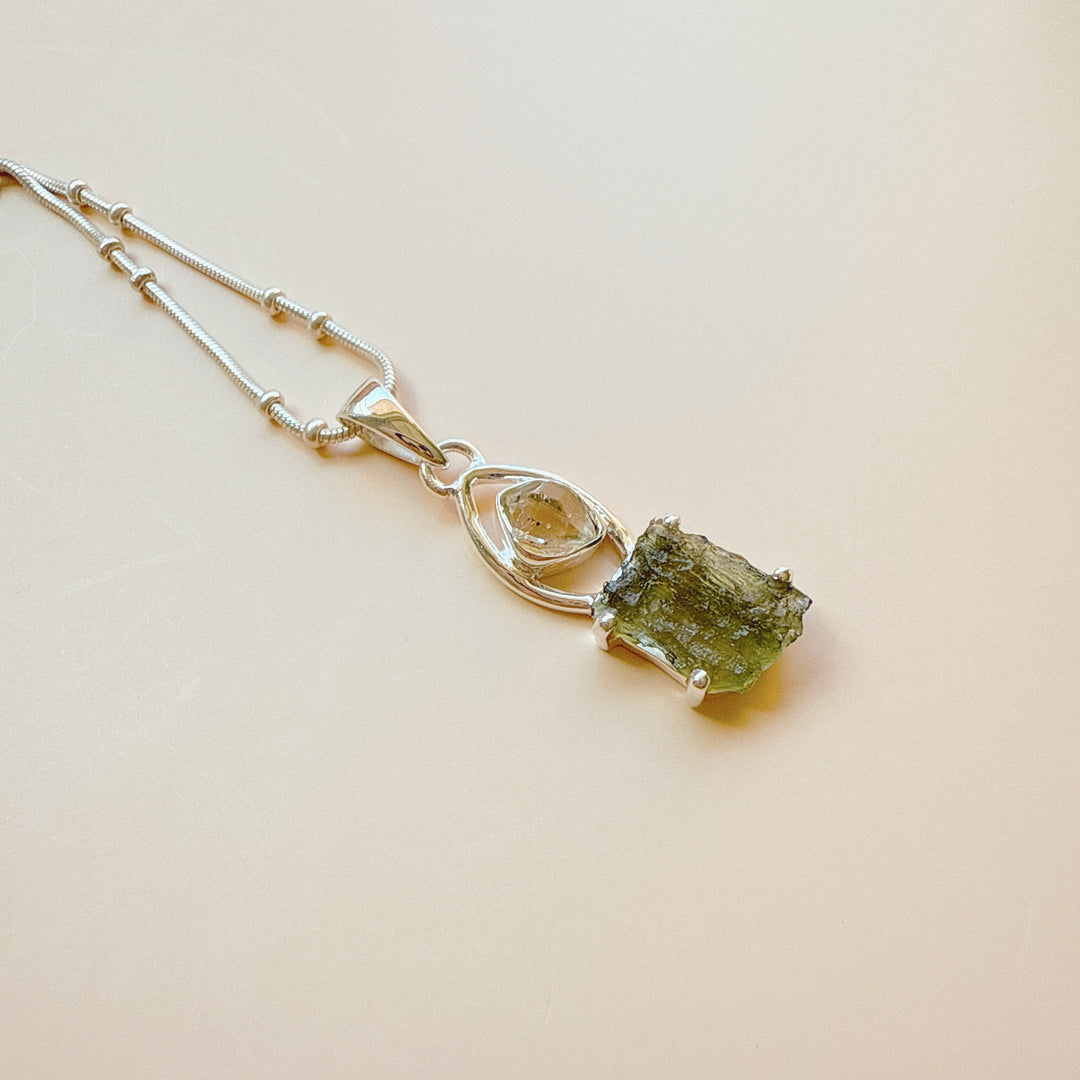 MOLDAVITE & HERKEMIER DIAMOND PENDANT